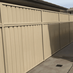 a fence next to a house